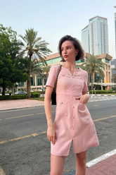 a lady wears a pink single-breasted sequins tweed mini dress